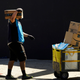 An Amazon delivery worker wearing a mask and gloves in downtown Los Angeles in October 2020.